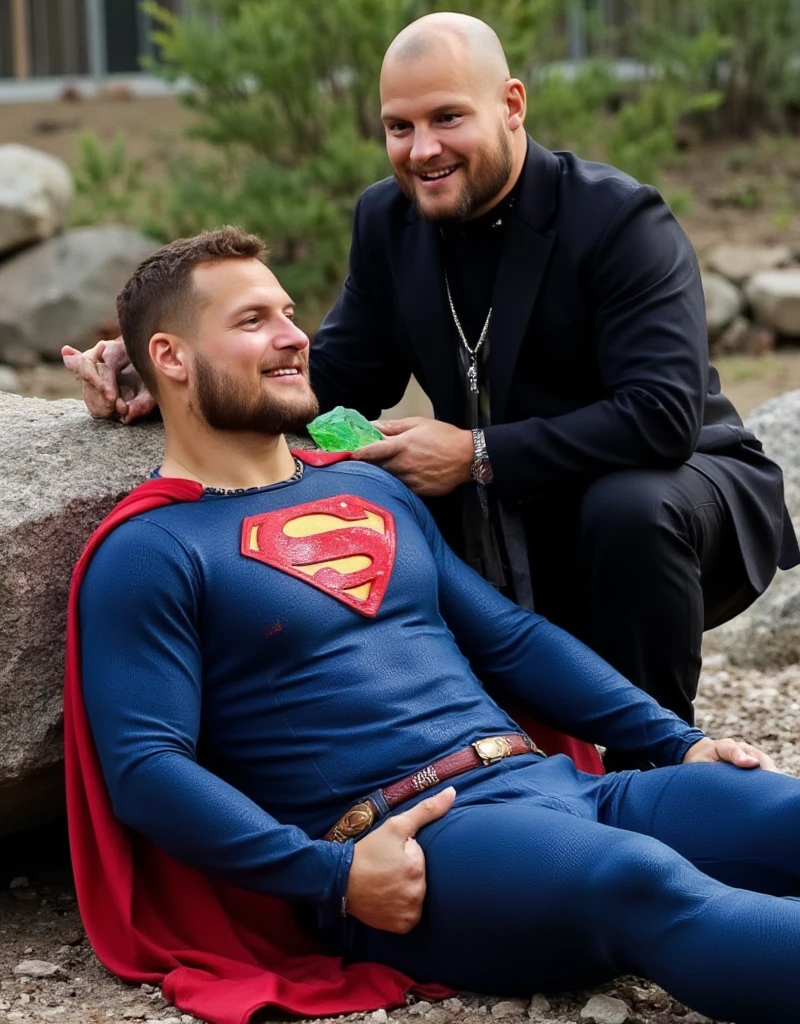 muscular attractive Nick bosa, with an undercut haircut combed back, short beard, wearing blue, form-fitting Superman suit with gold accents in the waistband, his chest displays the iconic "S" symbol. Superman's traditional red cape is present, attached to the shoulder and flowing behind him, lies on a rocky floor leaning against a rock, sore, with his mouth slightly open, he appears weak and in pain. Expression of pain, with blood on his face. Standing next to Superman is a bald man, dressed in a dark suit, The bald man holds a bright green crystal in his hand near Superman's chest
