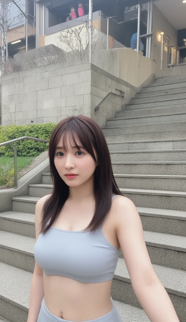 Wearing a mini dress, I'm going down the stairs one step at a time while commuting、 The woman has big breasts and a glamorous body 、The target woman is photographed from below 