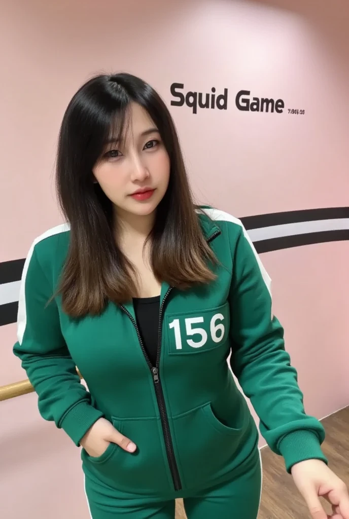 A 25-year-old Korean woman with long hair, a pretty face with clear details, wearing a green Squid Game outfit, green long-sleeved overalls with white stripes. The zipper unzipped, revealing her breasts. On her right chest is the number 156. She stands in a room with pink and white stripes and the text "Squid Game" written in black, contrasting with the pink on the wall.