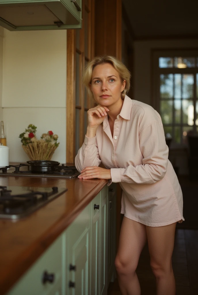 Cute looking blonde Swedish mom in her late 40's, in her kitchen. She is bent over her kitchen table. Beautiful thighs.