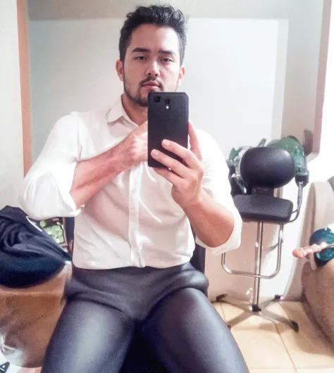 Masculine man holding a mobile phone