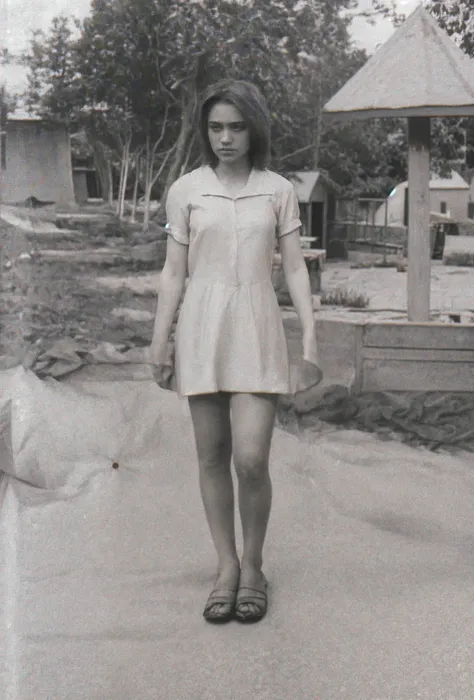 There is a woman walking down a sidewalk in a dress - SeaArt AI