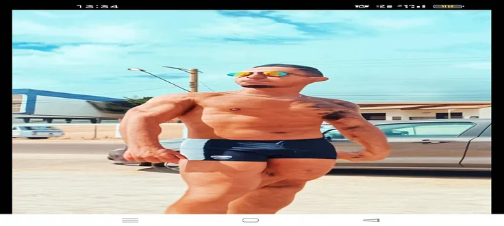 Um homem loiro, musculoso, olhos azuis, corpo musculoso e proporcional, com cueca de renda, rasgada. Com grande volume, protuberance. He is excited touching your nipples. No mato. Sentado em.a tree trunk. In the background there are boys watching him