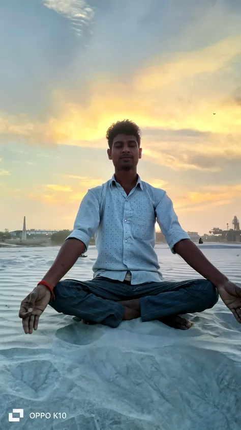 create realistic high quality image where a 20 year old Indian boy sitting & praying ahead to Ganesh ji, boy wearing saffron t-shirts on which name "Harish" is written boldly, beautiful background, sunrise, devotional atmosphere,Traditional temple, make sure name should be visible & correct.