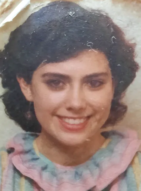 there is a black and white photo of a woman with a flower in her hair, in her early 3 0, old photo, grainy damaged photo, old photograph, in her early 20s, realistic old photo, vintage closeup photograph, grainy photo of an ugly woman, realistic old photograph, very old photo, old color photo, black and white old photograph