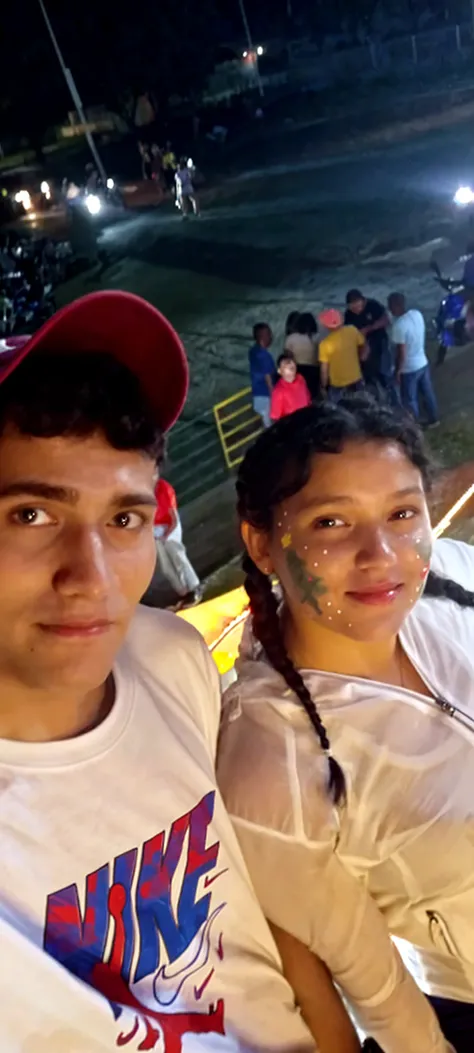 A young politician with a tall chubby presence , hugging people in a city like Santa Rosa El Oro in Ecuador .