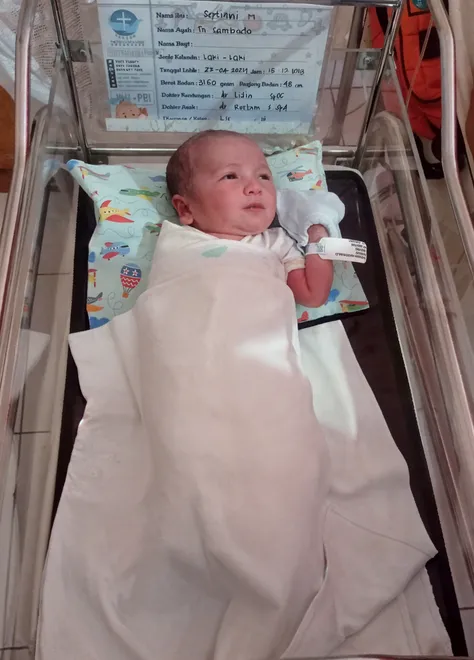 5 year old boy with cancer, sitting on hospital bed, hospital gown, realistic photo quality