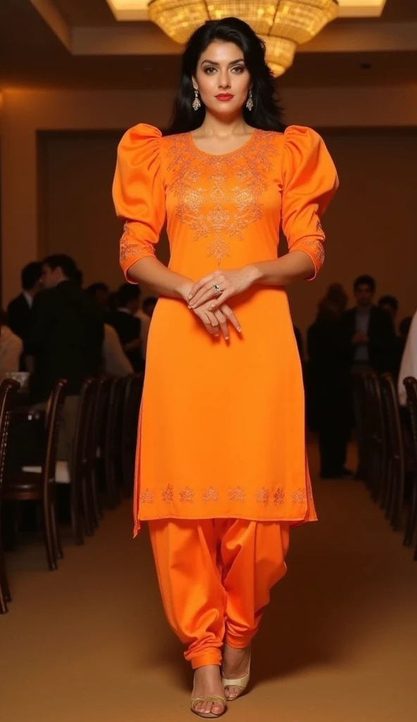 a tall fat v shape body figure woman stands straight gracefully at a party,camera-facing with her hands  together in front of her.she is wearing a punjabi-style outfit made of orange satin floral design work fabric kurti. the round-neck kurti has exaggerated puffy shoulders, adding a dramatic flair, and fitting 3/4 sleeves for an elegant touch. paired with satin fabric dhoti-style shalwar,the look is completed with high heels that accentuate her poised stance,exuding sophistication and allure.