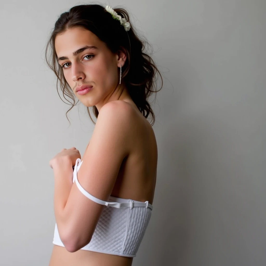 Young half-naked lady looking to the left with her hands holding some clothes 
