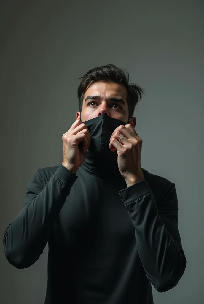 A man standing straight and wearing a blind fold on his face and belts in his hand