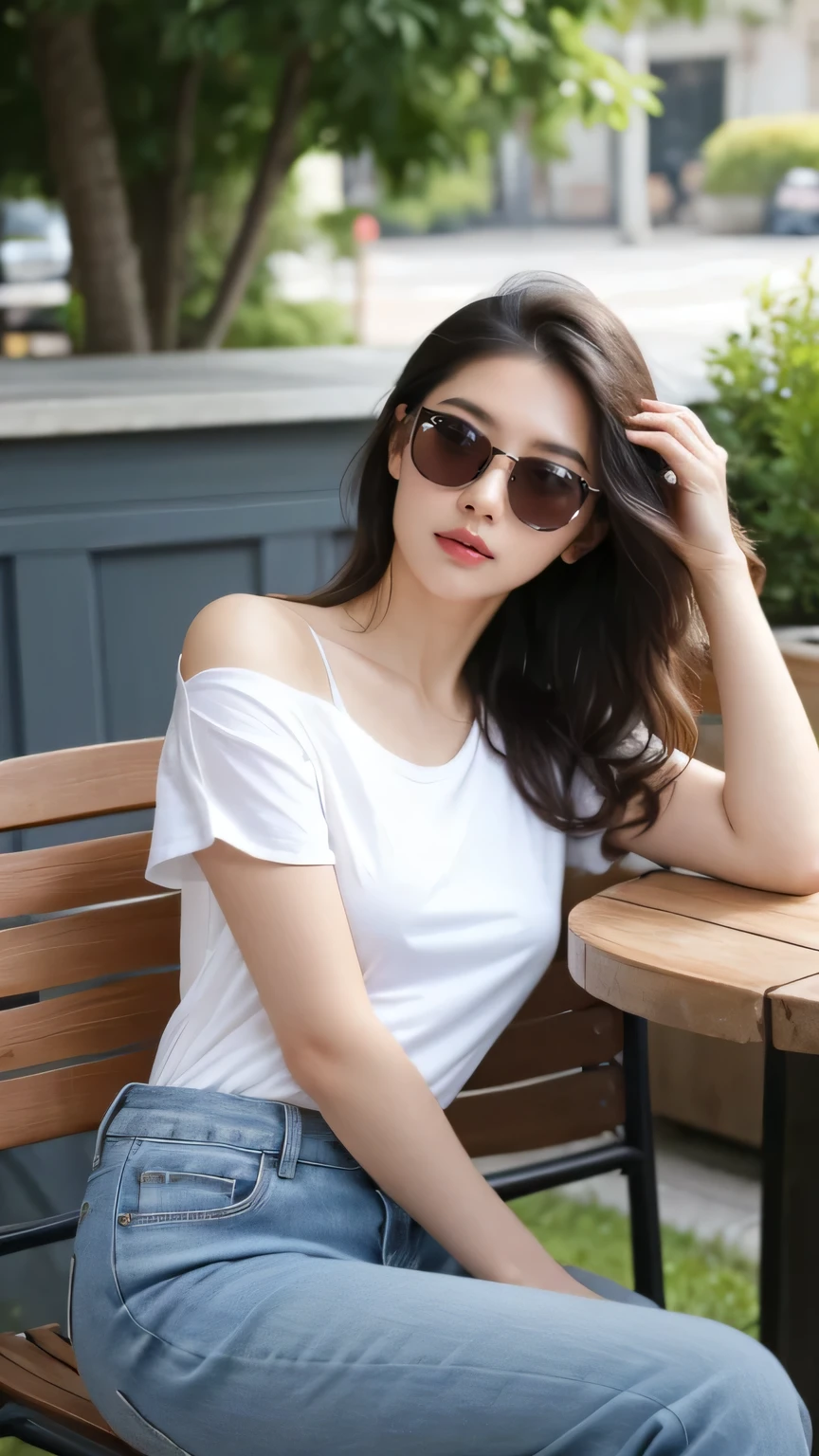 A striking young woman with wavy, shoulder-length dark hair sits at an outdoor café table on a sunny weekend morning. She’s wearing a simple white t-shirt tucked into high-waisted jeans, paired with sleek sunglasses resting on her head. In front of her, a half-finished croissant and a steaming cup of cappuccino sit on the table, alongside a paperback novel with a folded corner. She leans back in her chair, tilting her face slightly toward the sunlight, eyes closed in quiet appreciation of the warmth. Around her, the lively chatter of other patrons fills the air, accompanied by the occasional bark of a dog or the distant hum of a passing bicycle. A potted plant on the table casts delicate shadows across her hand as a gentle breeze rustles the pages of her book, making the moment feel effortlessly serene and alive.
