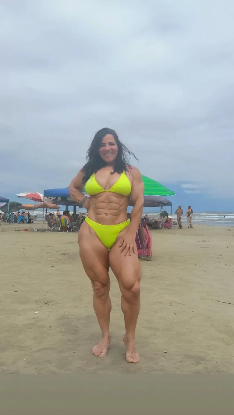 (best quality,4k,8k,highres,masterpiece:1.2),ultra-detailed,(realistic,photorealistic,photo-realistic:1.37),Dominican curly hair, burgundy hair colored, mature woman, 60-year-old, floral bikini, standing tall, the jungles in Brazil , (vivid colors:1.1), (sharp focus:1.1), (physically-based rendering:1.1), (extreme detail description:1.1), portraits, landscape, (studio lighting:1.1), (bokeh:0.9), vibrant colors, natural lighting