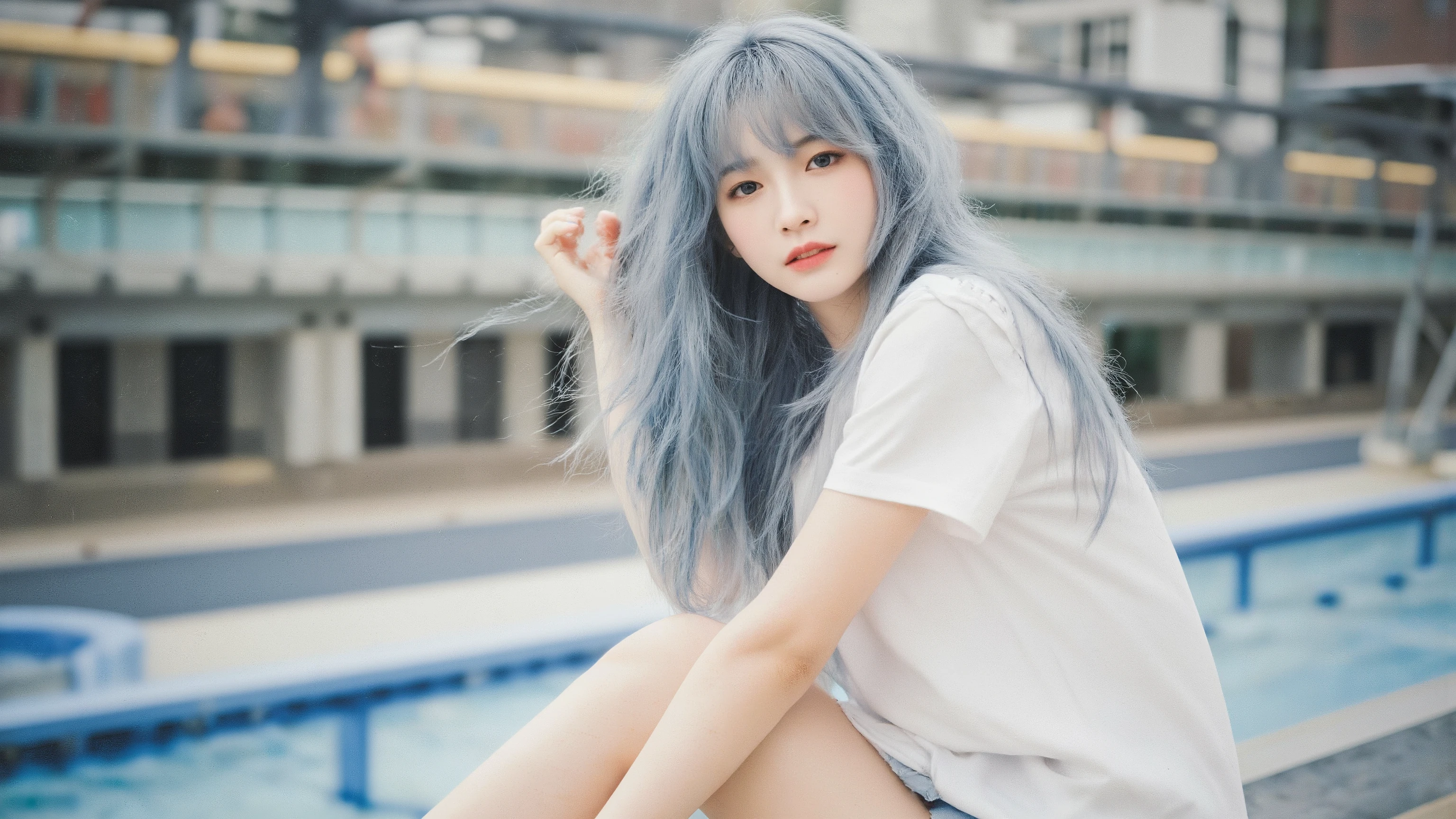 18 year old chinese girl,Light blue long hair,Idol Girl Group Light Makeup , white short sleeve, jeans shorts , long legs