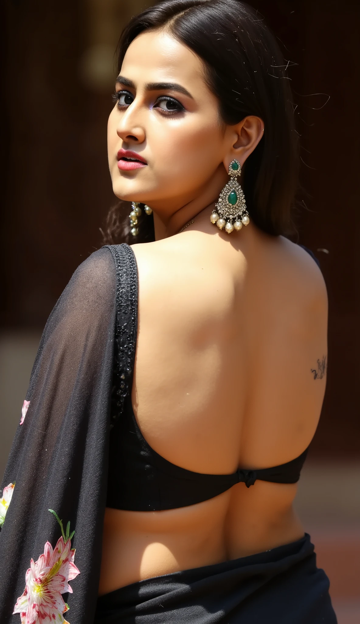 Design a striking image of a woman in a backless saree, walking through a glamorous, dimly lit ballroom or nightclub. Her saree clings to her curves, and the low light casts shadows, highlighting her back and contours. She looks straight at the viewer, her gaze intense and magnetic. The contrast between the dark environment and her radiating beauty creates a sense of drama and allure."