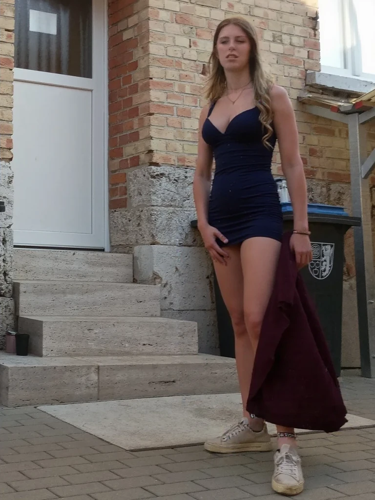 22 year old white female、Hair color is platinum blonde、blue eyes、long hair、straight hair、accessories on wrist、I'm wearing a choker、skin is smooth、smile、Slender but muscular body、My heart is pounding、smile、wearing a plunging neck dress、I'm wearing lace-up sandals、I'm sitting in the middle of the stone steps in the old town.