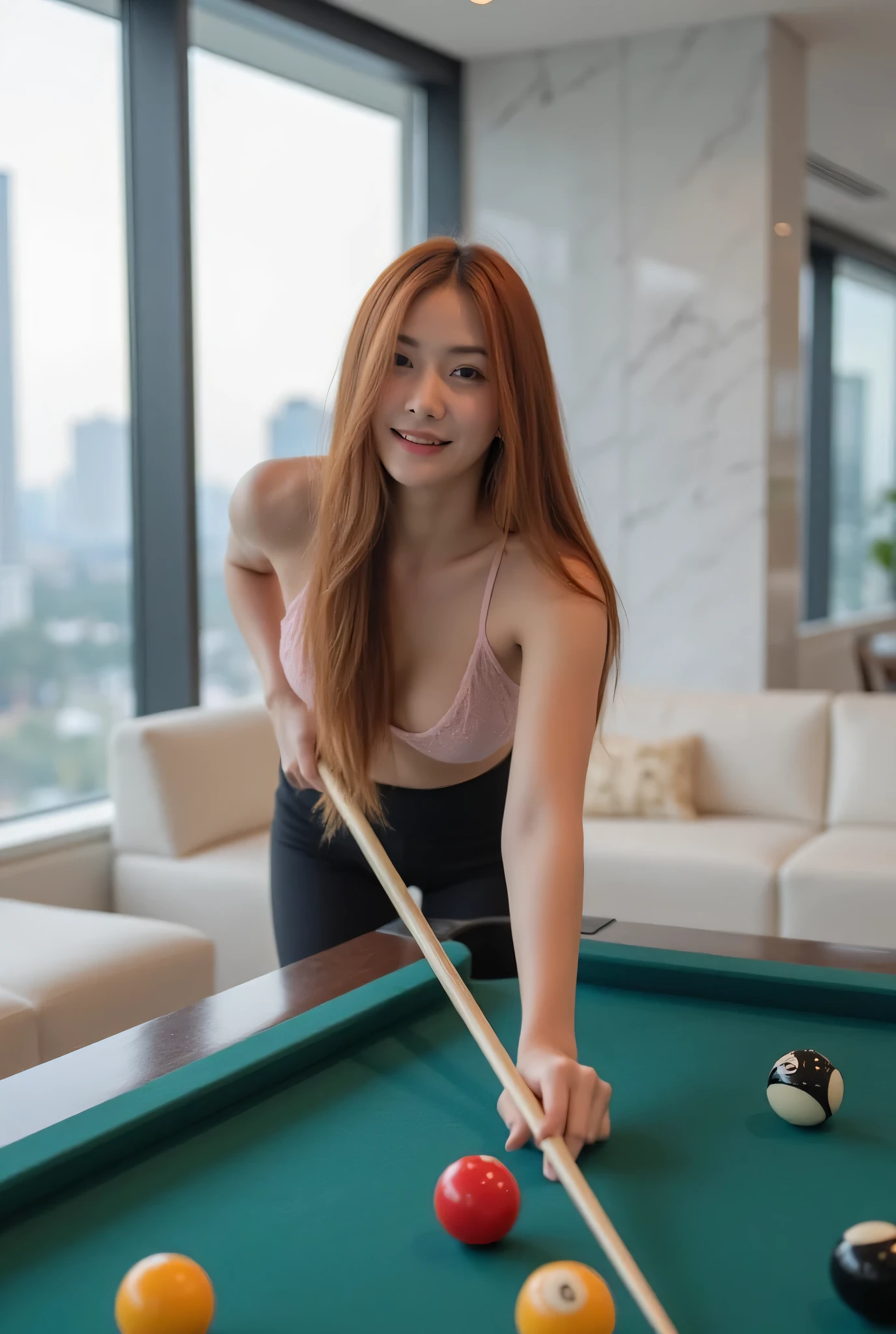 A very beautiful Thai girl with long reddish-brown hair wearing black yoga pants and a light pink lace bikini. She is playing billiards on a dark green billiard table. She holds a light brown wooden cue, smiling slightly. Several billiard balls are on the table in vibrant colors including white, red, yellow, and black. The background is a luxurious and modern living room decorated with white marble tiles. Large glass windows show a city view. The lighting is bright, creating a comfortable and warm atmosphere. The image should be high resolution with clear details. Natural-looking shadows and highlights are present on the subject and billiard table. The overall image is balanced, beautiful, and professional-looking.