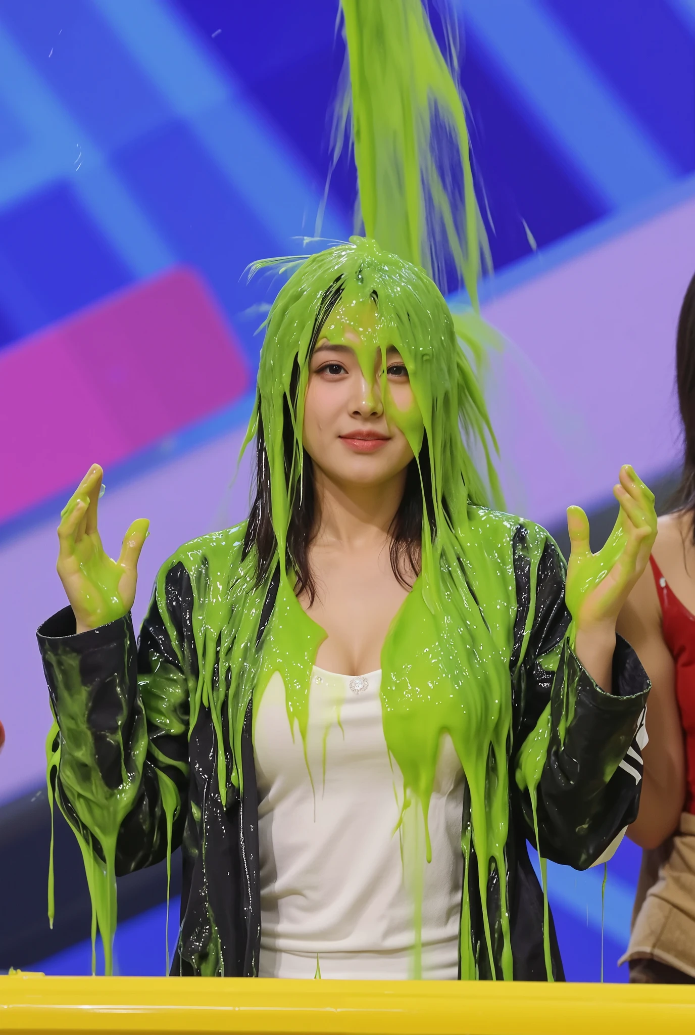 A lively and colorful moment captures a Korean woman seated on a stage, getting drenched in a thick cascade of vibrant green water pouring from above. The individual, wearing a white shirt with cleavage and a black jacket, reacts with raised hands and an expression of surprise as the gooey substance completely covers their head and shoulders. The background features a dynamic, geometric pattern in shades of blue, pink, and purple, adding to the playful and energetic atmosphere. A yellow table or podium is visible in the foreground, suggesting a game show or award event setting. an unexpected sliming moment. The image embodies a fun and messy celebration reminiscent of classic Nickelodeon-style slime events. raining slime. green slime. (Photorealistic: 1.4)