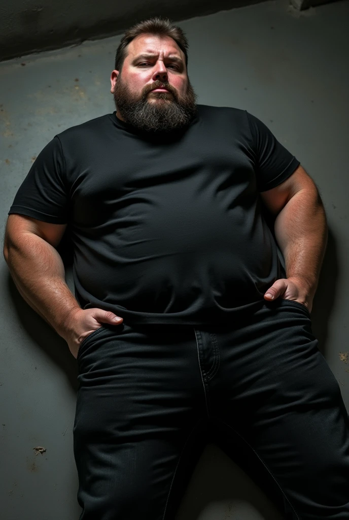 A closeup shot of a morbidly obese man shirtless and bearded sitting at a table manipulating a marionette on top of the table