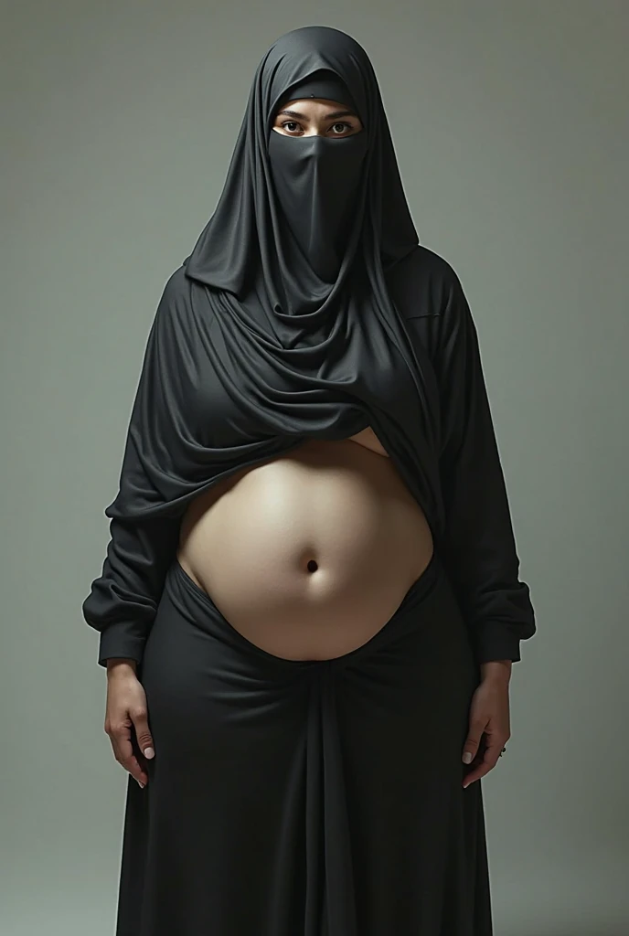 Studio photo of a pregnant woman wearing a hijab