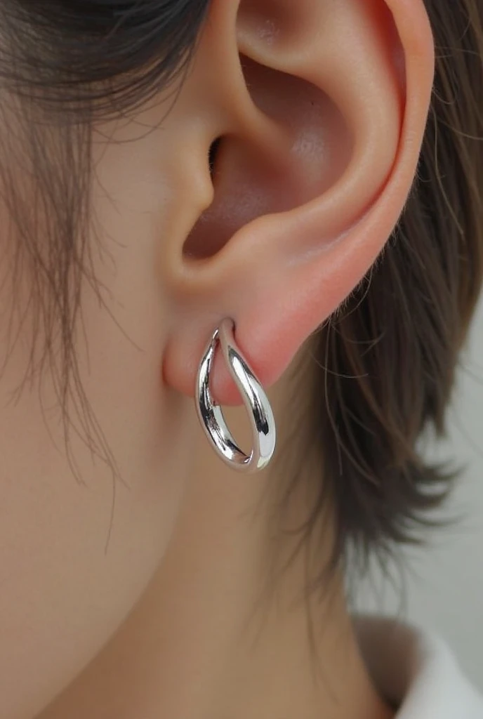 Small spiral silver earring for men.