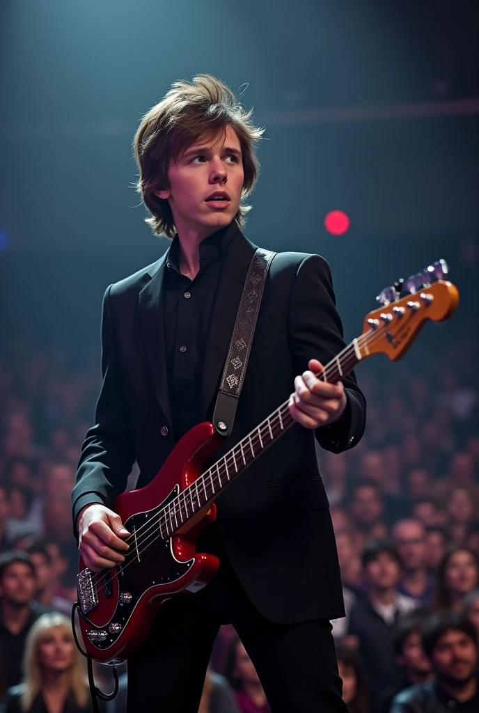 Tom Holland with Paul MacCartney-style hair, black suit and electric bass at a concert