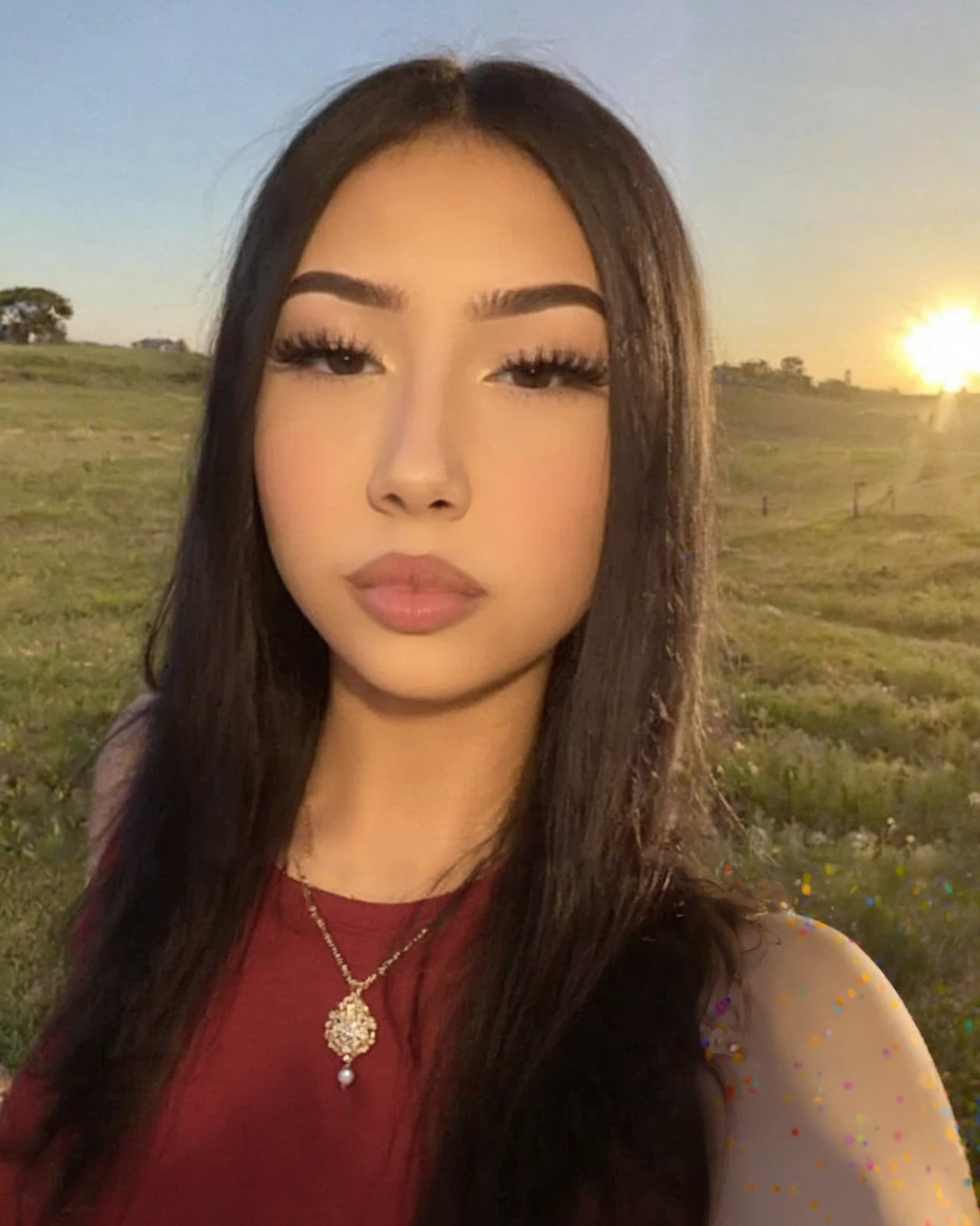 Close-up photography of the face of a beautiful 18 years old, wearing copypaste makeup, taking selfie of herself, wearing red, outdoors