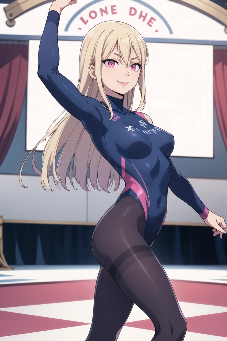 A beautiful barefoot woman with short wavy strawberry-blonde hair, wearing a black leotard, squatting on a yoga mat, looking happy.