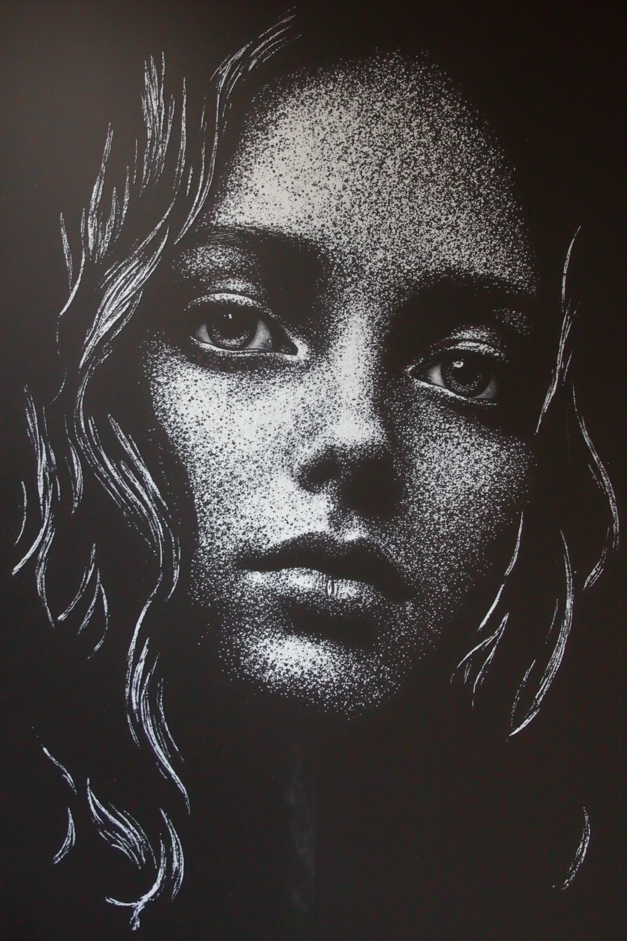 A black chalkboard doodle featuring a beautifully detailed drawing of a very pretty girl's face. The portrait is created using only white chalk, emphasizing the contrast between light and dark. The artwork captures her delicate and graceful features with soft shading and expressive linework, giving depth and emotion to the piece.
Her eyes are large and captivating, framed by elegant, flowing hair that is drawn with dynamic chalk strokes. The texture of the chalk medium adds an artistic, raw quality to the portrait, highlighting subtle facial details. The drawing focuses on her face, creating a striking monochrome aesthetic that stands out vividly against the blackboard background.
The composition remains minimalistic, ensuring that the beauty of the subject is the central focus while maintaining the classic charm of chalkboard art.