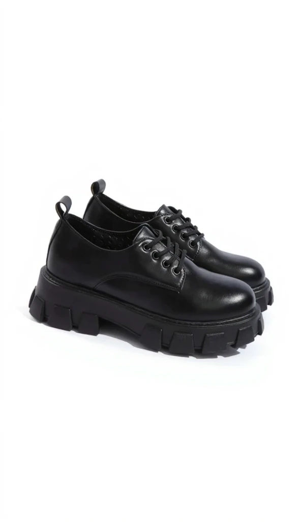 There was a woman sitting on a bench wearing black shoes, Black shoes,