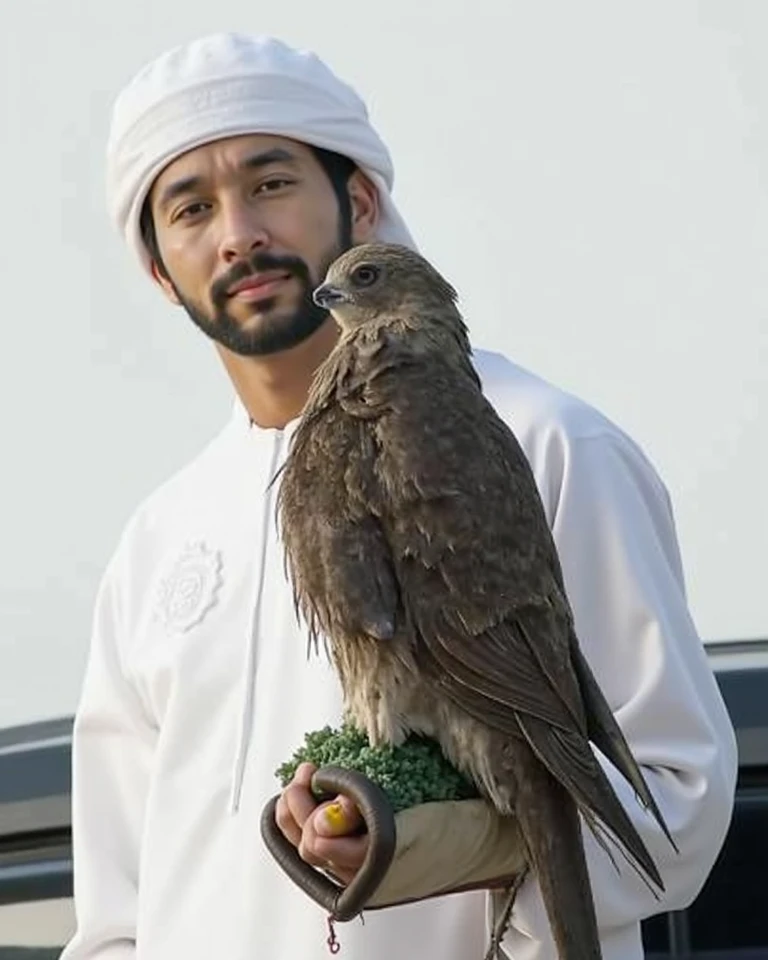 hand touch eagle nose, fingers touch the tip of eagle nose, eagle face full
