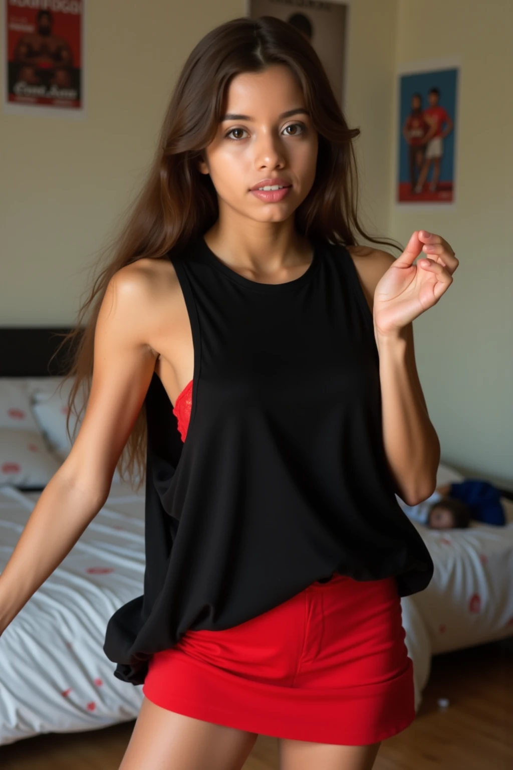 (((young girl))) (()) wearing a red strapless blouse, and black jeans standing in a bedroom