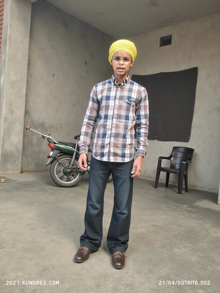 A Bangladeshi boy standing. Wearing pink denim.in his denim named "APU".