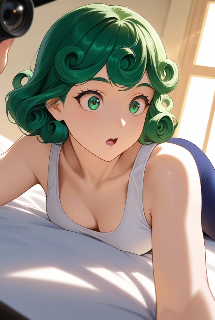 green curly hair, wearing a white sports bra and dark blue leggings, lying on bed, relaxed pose, looking over shoulder at the camera, surprised expression, fair skin, indoor setting, sunlight streaming through window, warm light, soft shadows, casual atmosphere, close-up angle, focused on subject, smooth skin, no visible accessories