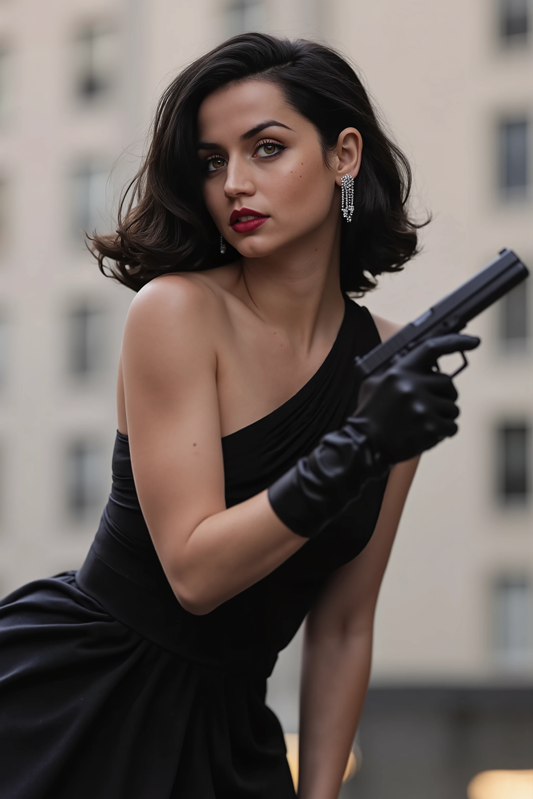 A young woman, light-skinned, with shoulder-length, wavy black hair,  red lipstick , and noticeable, expressive eyes, is depicted in a three-quarter view.  She's holding a handgun in her right hand, covered by long black satin gloves. Her expression is intense and slightly serious, with her gaze directed at the viewer. She's wearing a black, sleeveless,  mid-length, elegant gown.  Silver, dangling earrings and potentially additional jewelry are visible.  She has a slender build.  She is positioned slightly off-center, angled to her right, her body oriented toward the viewer.  The background is out-of-focus, with a blurred urban setting, light-gray and off-white buildings behind her. The lighting is dramatic, highlighting the woman's face and the gun while subtly darkening the background.  The image has a stylish, high-fashion, and slightly dramatic aesthetic. The overall composition and perspective are designed to create a sense of intrigue and suspense.