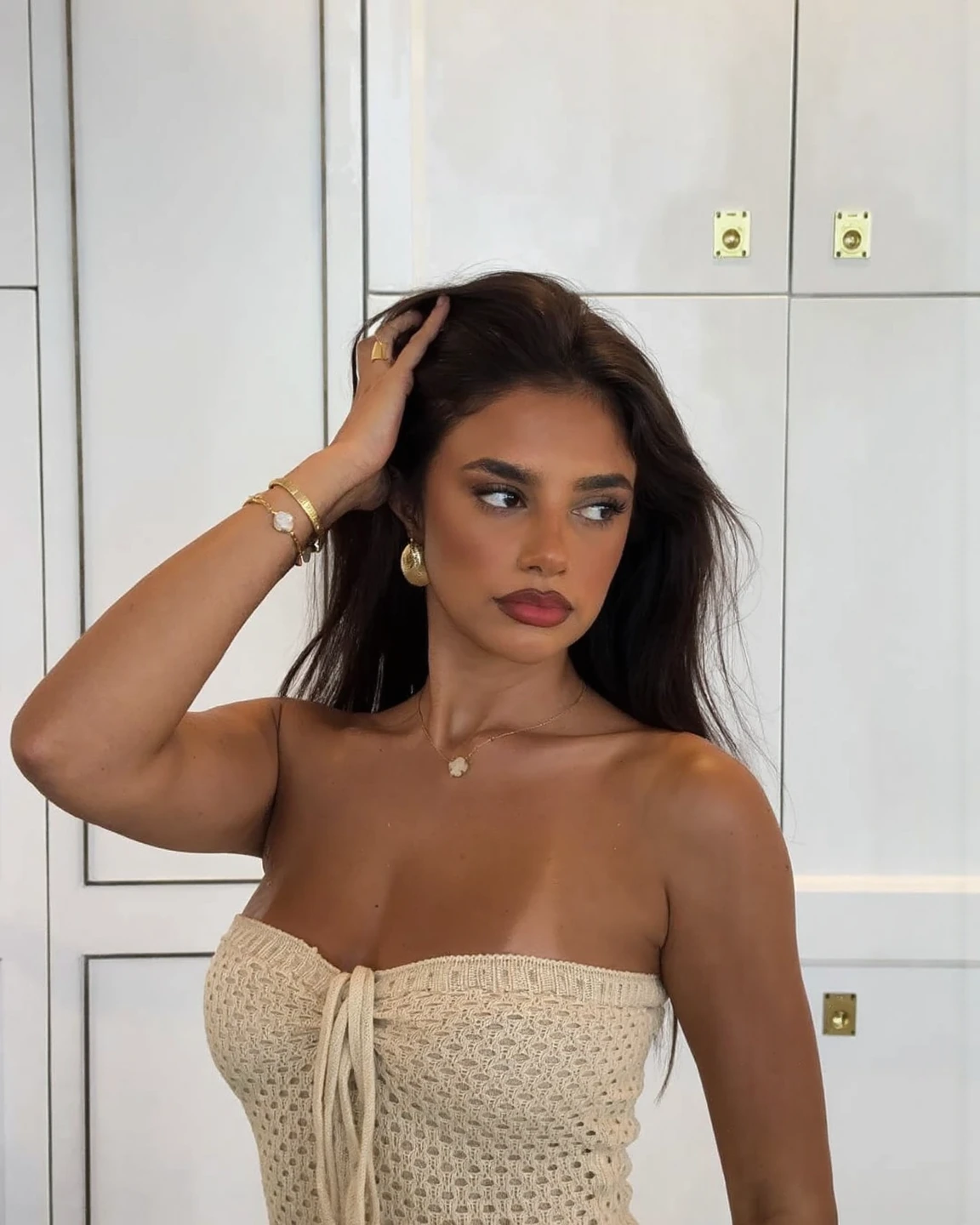 arafed woman in a silver bra top posing for a picture, portrait sophie mudd, anna nikonova aka newmilky, sultry smirk, brown hair and a perfect body, stunning mirror selfie,irina french, sexy girl with dark brown hair, anastasia ovchinnikova, angelina stroganova, violet myers, seductive smirk, gorgeous young model