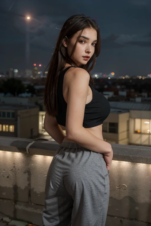 Photo D&#39 : sexy 20 year old brunette, she is wearing a tight black mini skirt, she is standing from behind, we see her entirely. she turns her head slightly. she wears a short black top and brown boots. she is on the top of a building, it is evening and we can see the lights of the city.