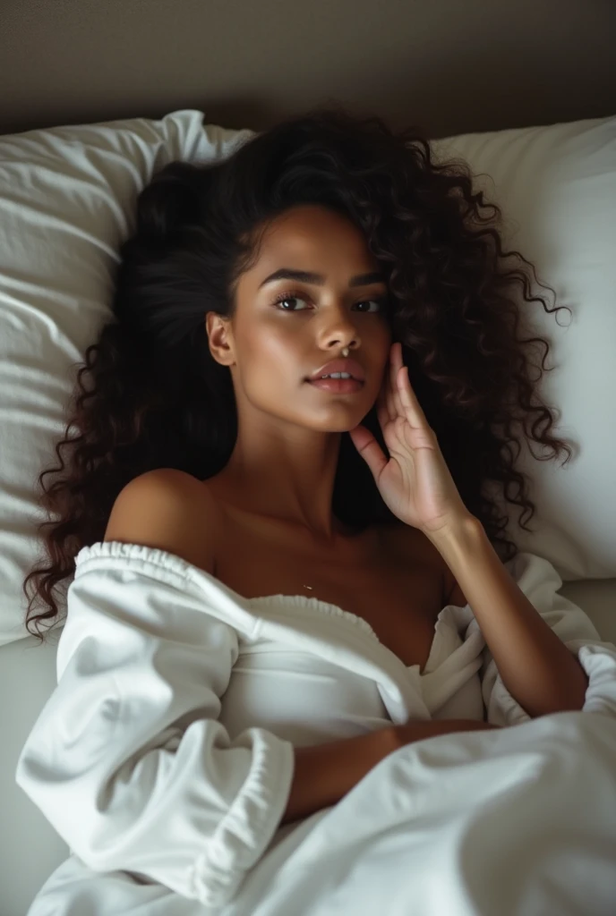  there is a black woman , the woman has curly black curly, she has brown skin, with dark brownish skin, with long curly, long black wet  bouncy curls  she is taking a long shot selfie snuggled up in her bed
