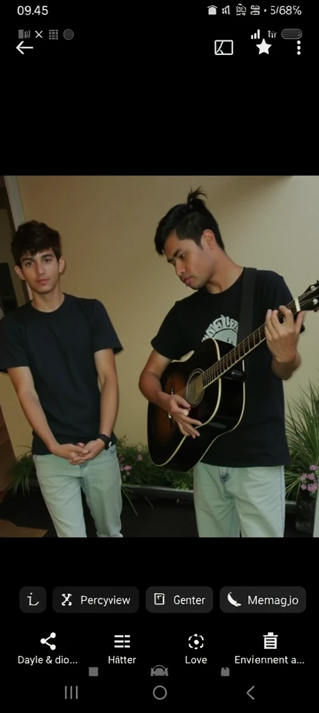 A young man is playing an acoustic guitar in a room that looks unkempt and messy, he wears large Headphones in his ears, has short hair, ((stout body)), and has tattoos on his arms.