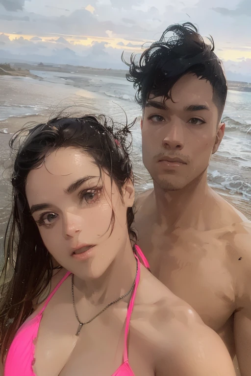 A old man sits on the beach with a woman