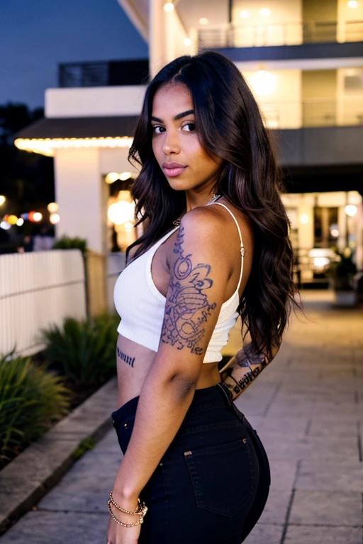 "A beautiful 22-year-old woman with a curvy body, medium-dark skin tone, and brown eyes. She has medium-length hair and tattoos adorning her arms. Her style is modern and confident, wearing casual yet stylish clothing that enhances her natural beauty. The setting is urban with soft lighting, highlighting her strong and captivating presence."

