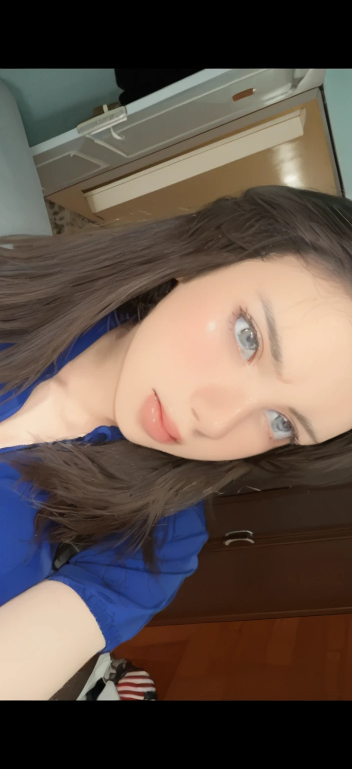 A woman with long black straight hair, blue eyes, white skin and curvy body lines.