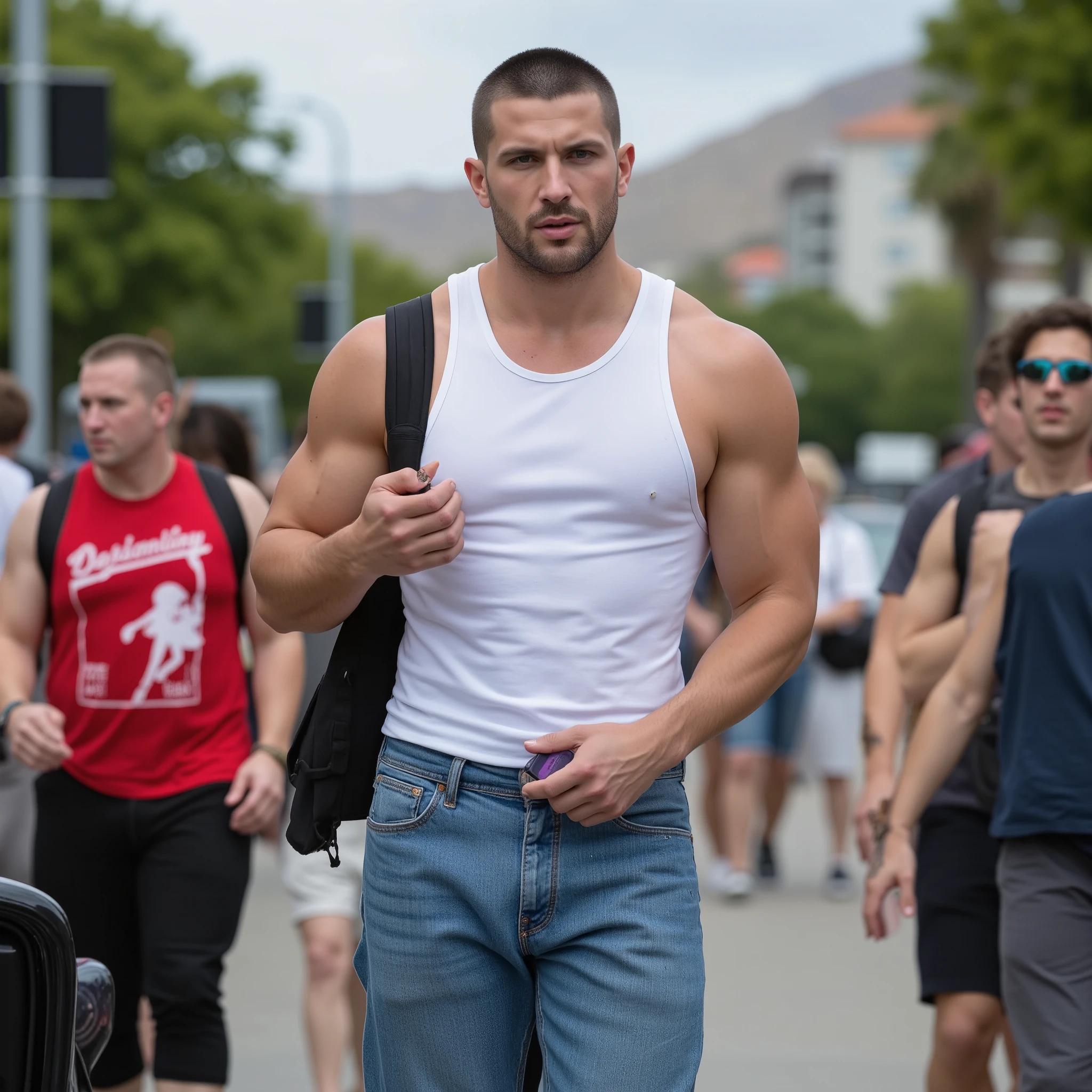 Create a photorealistic image of a 28-year-old tall muscular white man, Black buzz cut hair, rosto jovem, rosto fino, Long face, green eyes, defined jawline, strong forearms, pele clara, Small goatee. wearing a white tank top, shirt wearing wide jeans. He's walking on a crowded sidewalk in one in California while he uses a cell phone in one hand. (Looking away from The câmera) (Long shot)