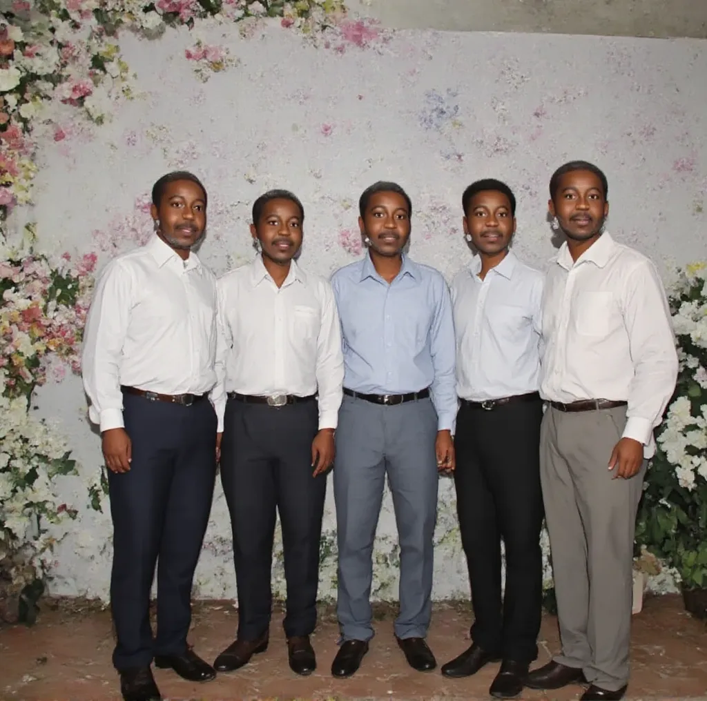 4 brides and 1 groom, the groom is standing in the middle wearing a vest and the brides standing on the sides are wearing white dresses The background is white and the brides stand out in the horizontal frame, each holding a bouquet of flowers.