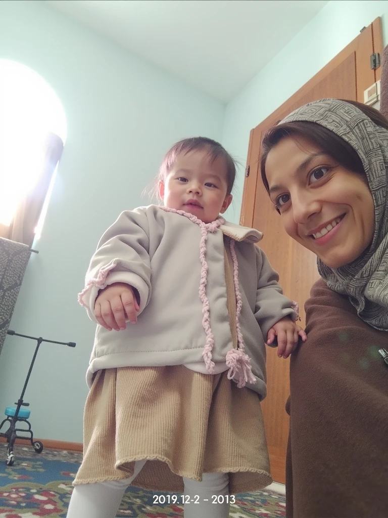 Pale skin Uzbek woman in hijab standing in room bracelet embracing her ebony African baby