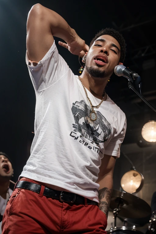 19-year-old man on stage singing 'Piel Canela' in reggaeton attire