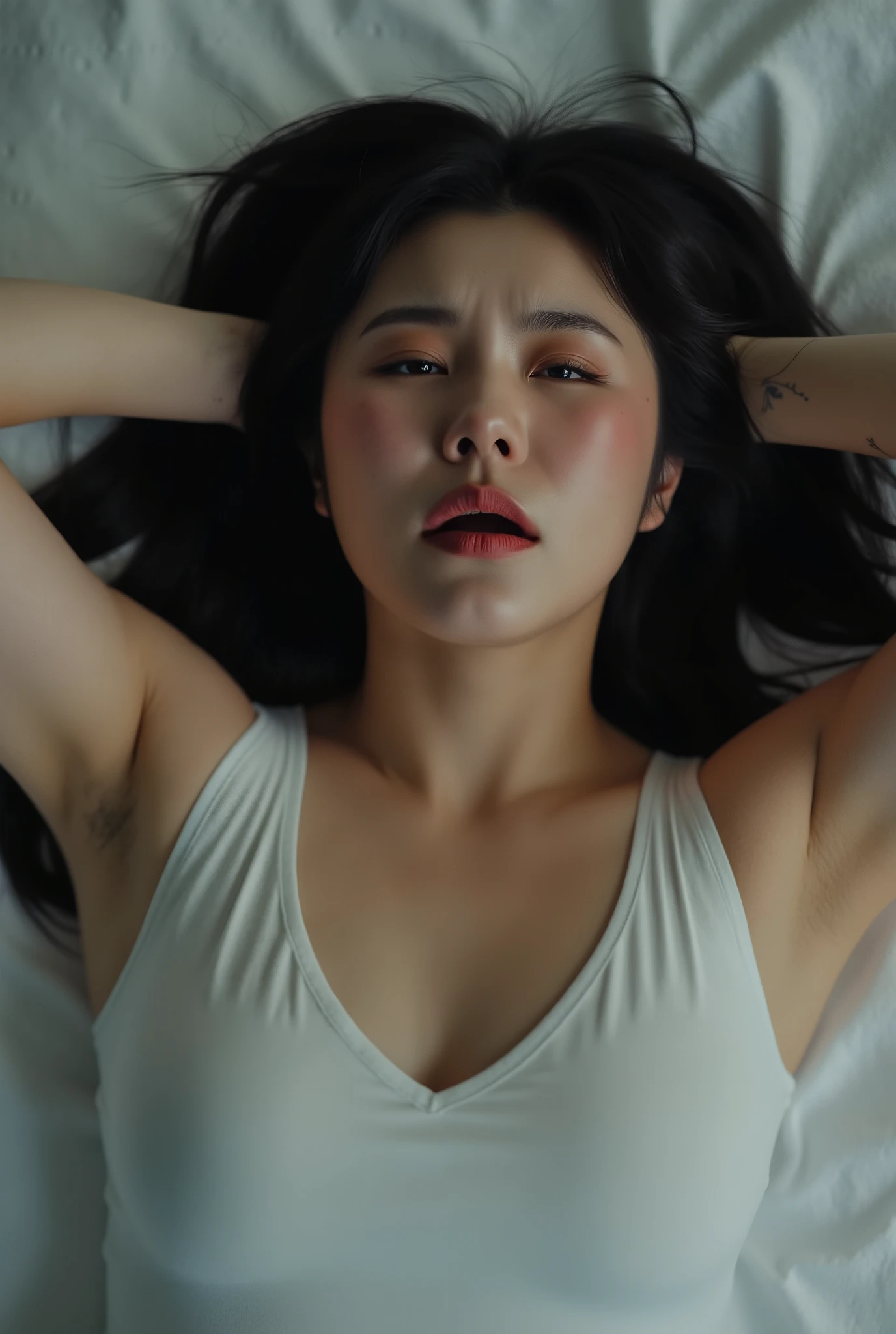 a korean woman, slightly curvy, wearing white tanktop, cleavage. ((crying face, Furrowed eyebrows, closing eyes, open mouth, face facing upwards)). lying on the bed. arms up, black hair, wh3ein