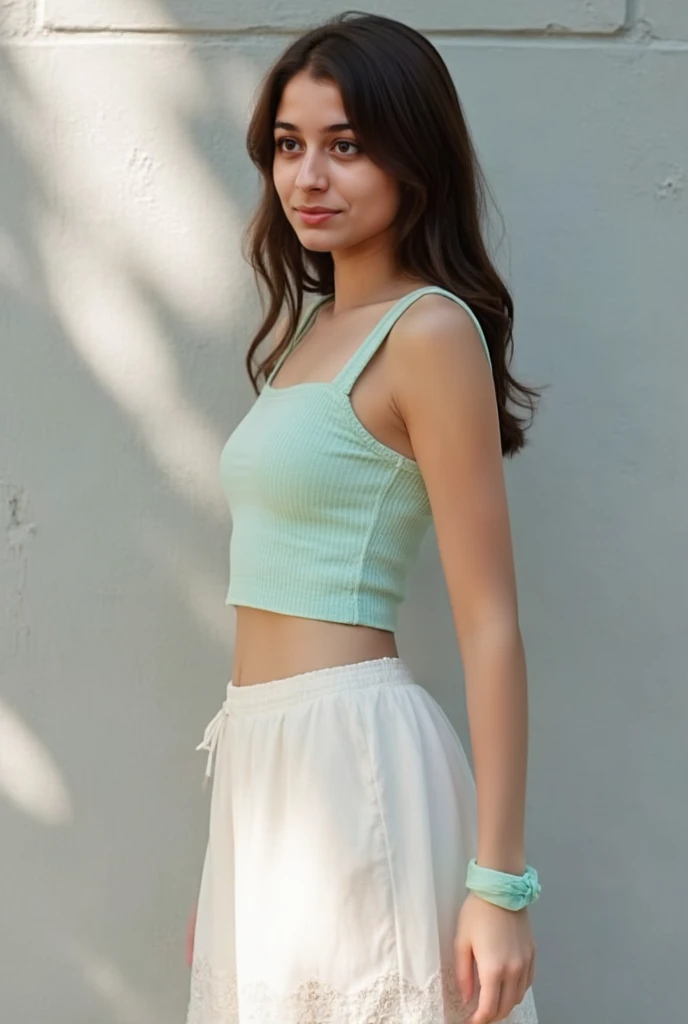 Flora is an hispanic 18 years old woman, slim body, tan-skinned, with long light-brown hair, and narrow green-jade eyes. Flora wears a bright yellowish-green off-the-shoulder smock top with puffy short sleeves that bares her midriff and belly, a pink wrap miniskirt with little slits on both sides, Pink Skirt
