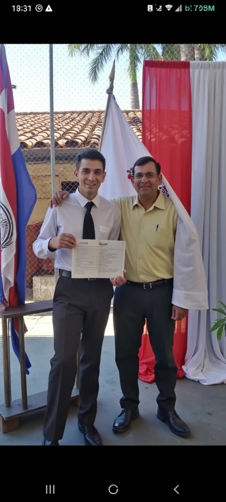 Arafed man in graduation gown holding a diploma and standing in front of a flag, graduation photo, 1614572159, ivan bolivian, wearing an academic gown, fotos de alta calidad, 278122496, 1786560639 que sea blanco y alto
