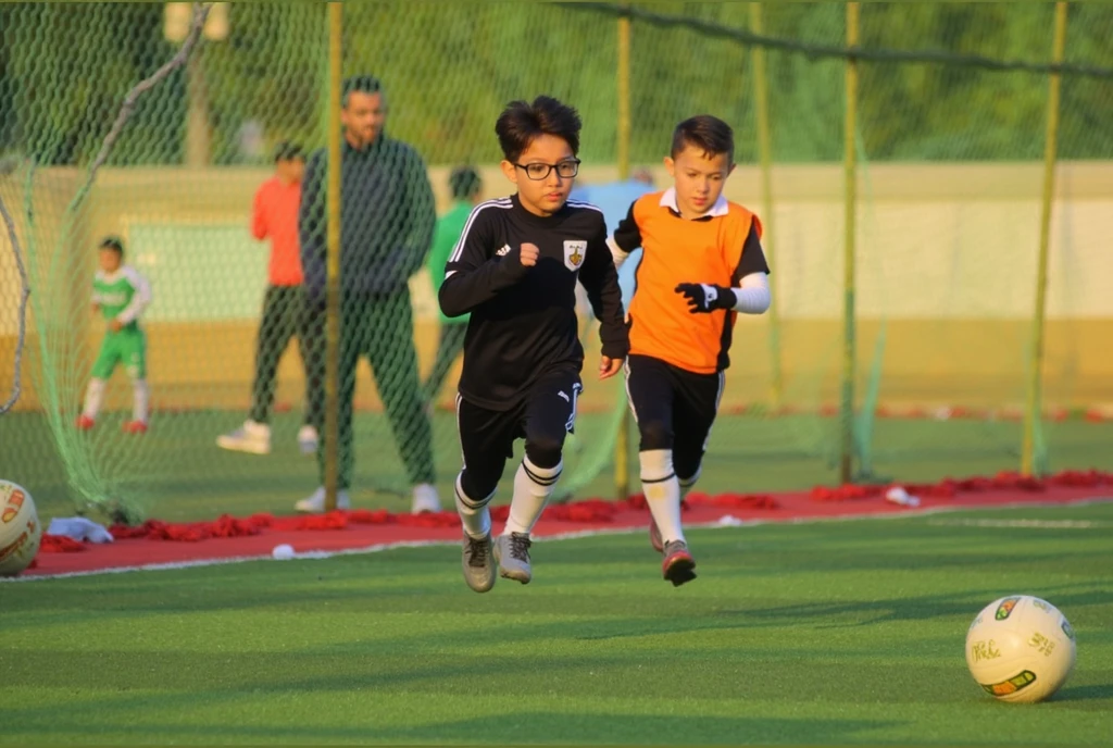 Children running with ball in hand