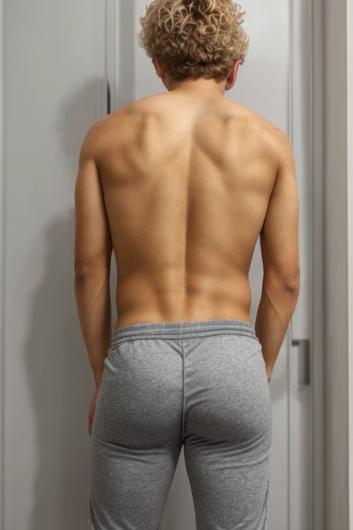 Young age boy, view from back, standing upright, grey pants pulled down, underwear visible, large bubble butt, very tight pink underwear, blonde messy hair, slightly tanned skin, wearing a tight grey t-shirt, young age, short
